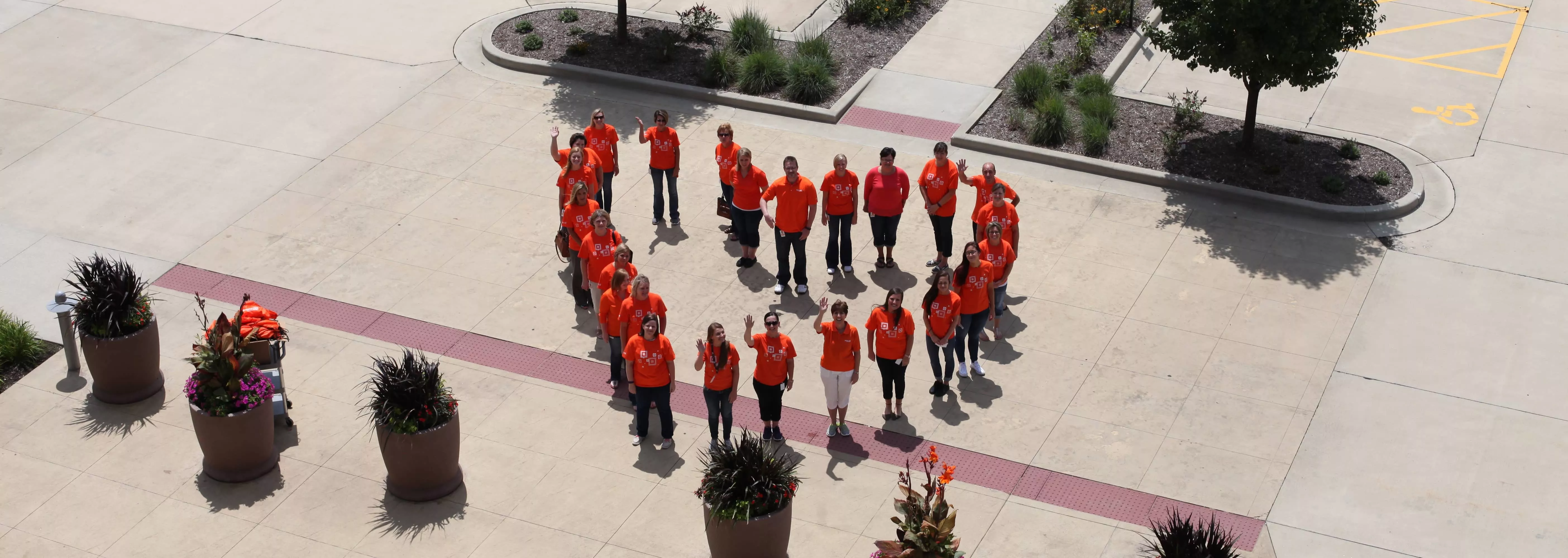 Aerial shot of Midland employees standing in a heart shape